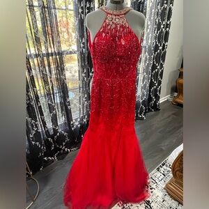 Red heavily embellished prom dress